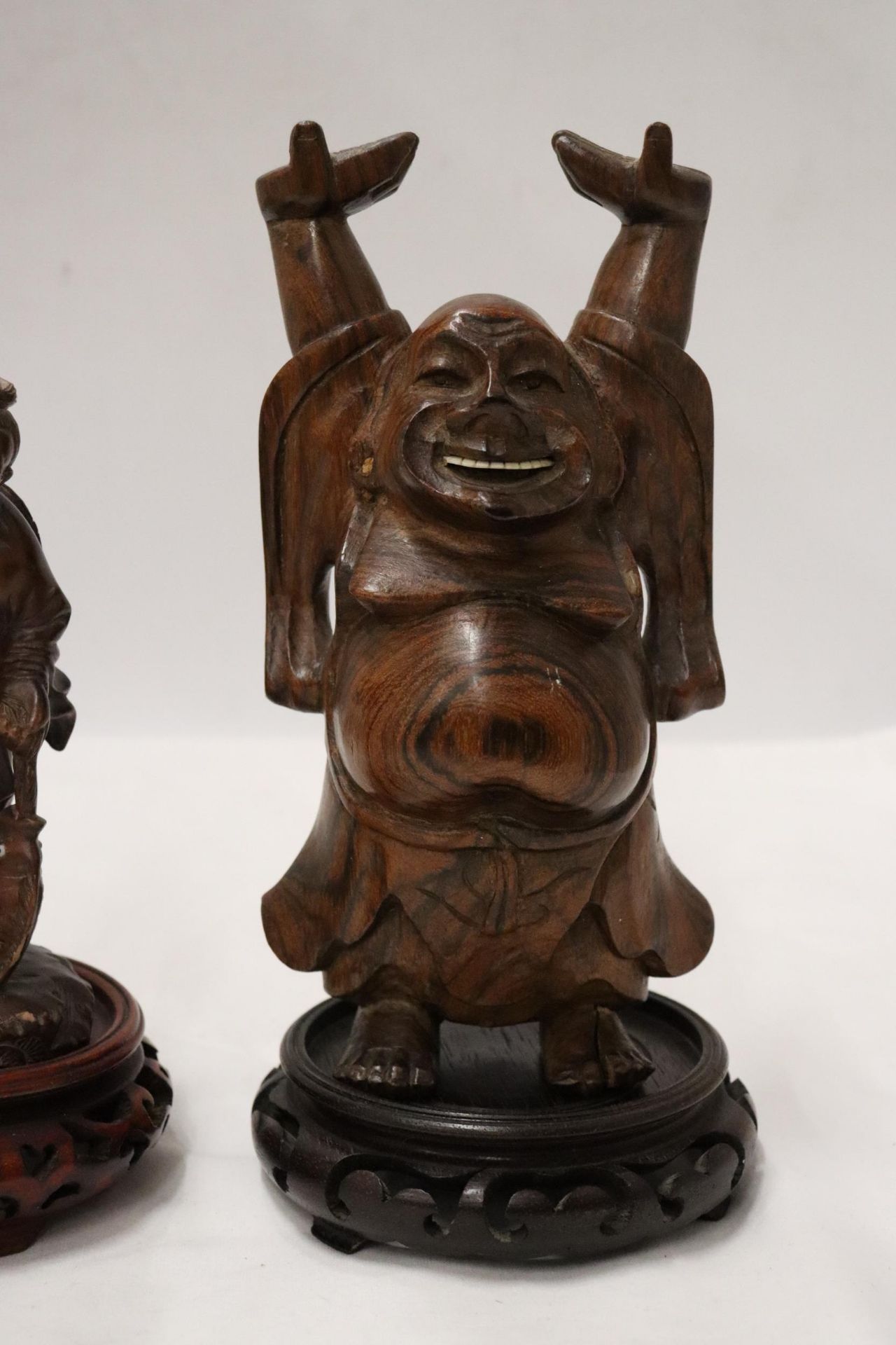 TWO CARVED WOODEN ORIENTAL FIGURES TO INCLUDE A LAUGHING BUDDAH, ON STANDS - Image 2 of 9