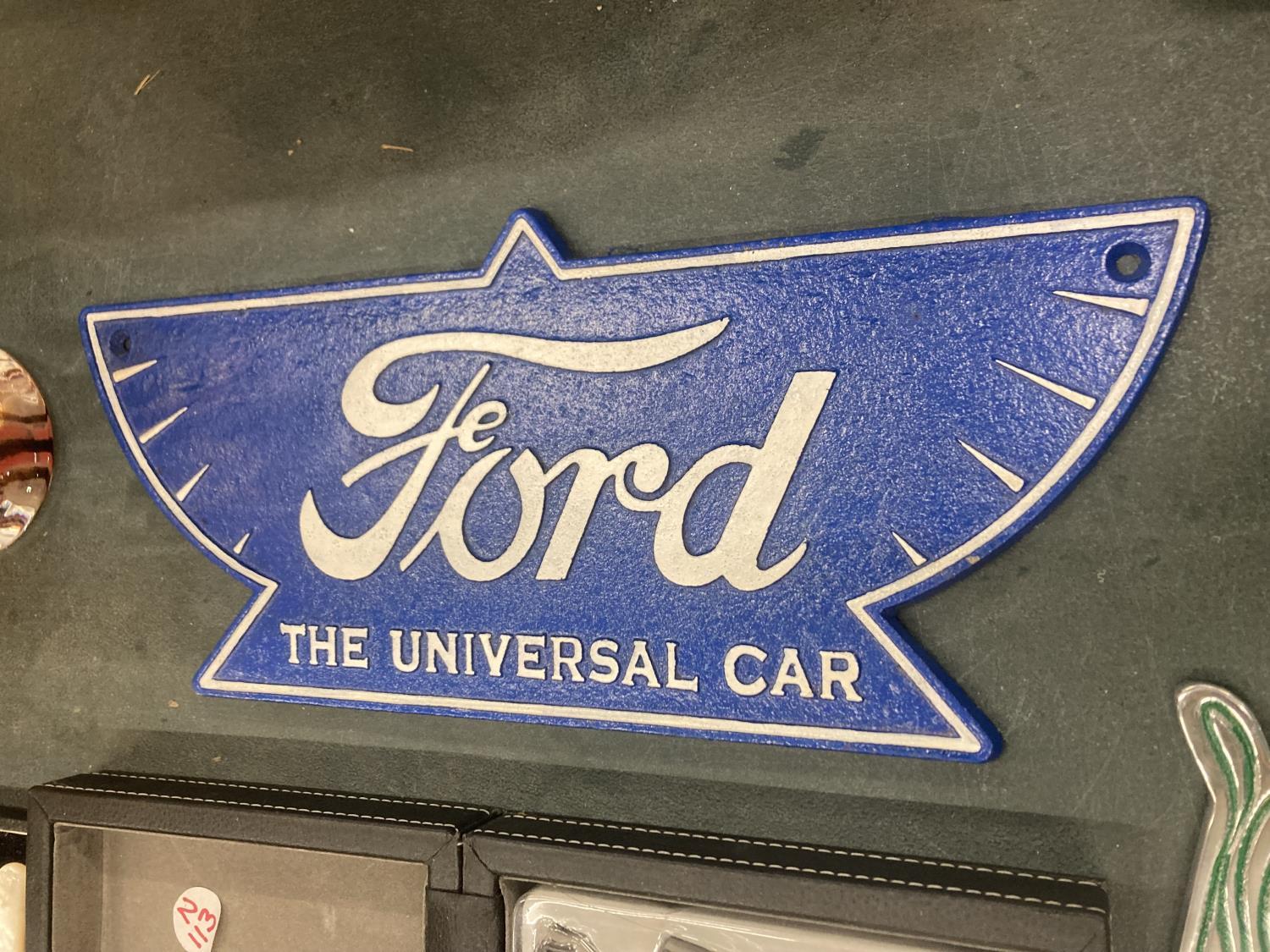 A CAST FORD THE UNIVERSAL CAR SIGN