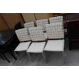 A SET OF SIX POLISHED CHROME DINING CHAIRS WITH CREAM FAUX LEATHER SEATS AND LATTICE BACKS