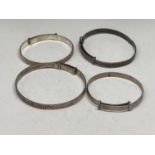 FOUR SILVER BABY BANGLES