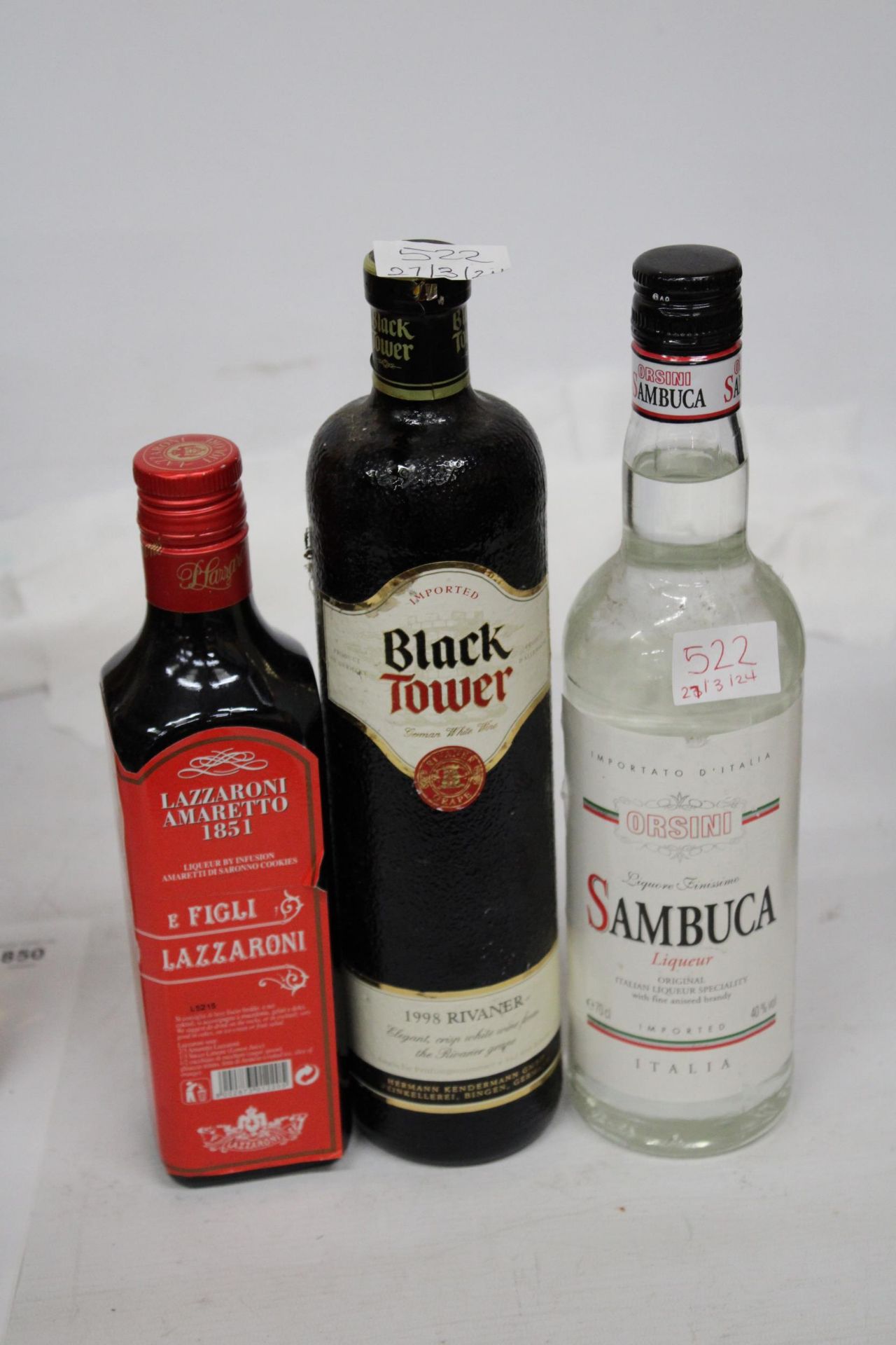 A BOTTLE OF ORSINI SAMBUCA LIQUEUR, A BOTTLE OF LAZZARONI AMARETTO 50CL AND A BOTTLE OF 1998 RIVANER