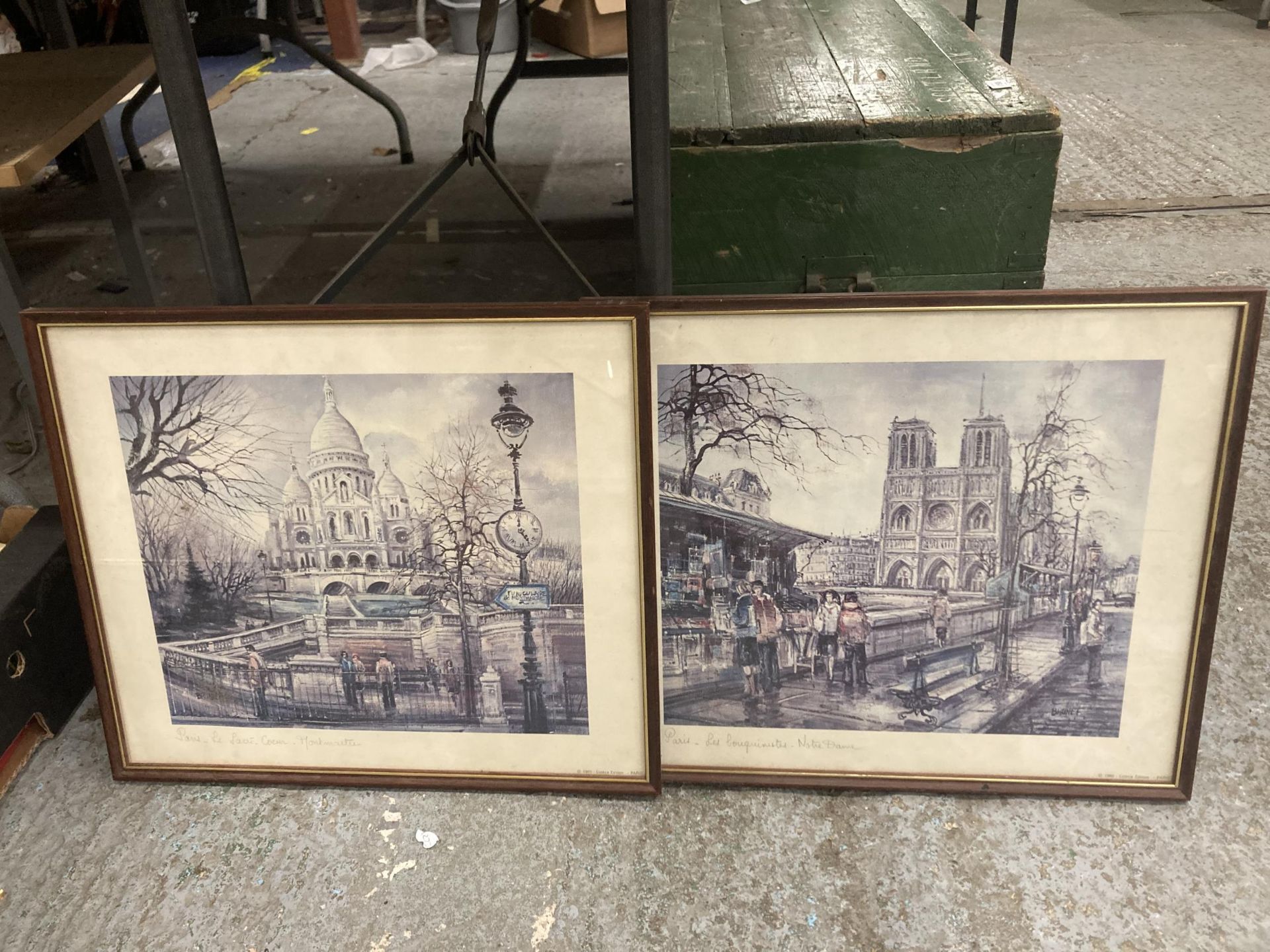 A PAIR OF PARIS RELATED PRINTS TO INCLUDE "LES BOUQUINISTES - NOTRE DAME AND LE SACRE COEUR -