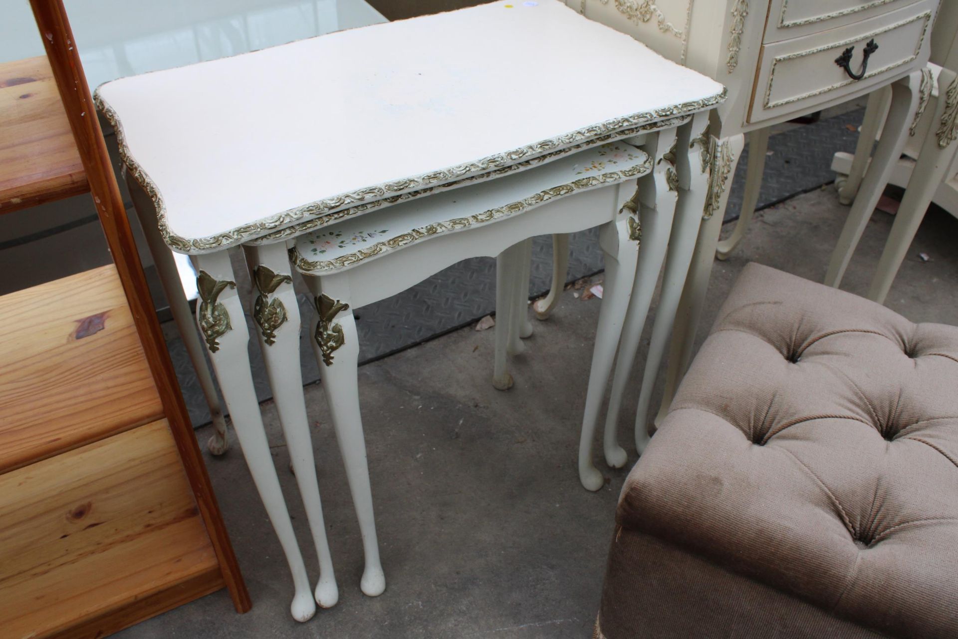 A PAIR OF CREAM AND GILT BEDSIDE TABLES, NEST OF TWO TABLES AND A POUFFE - Image 2 of 3
