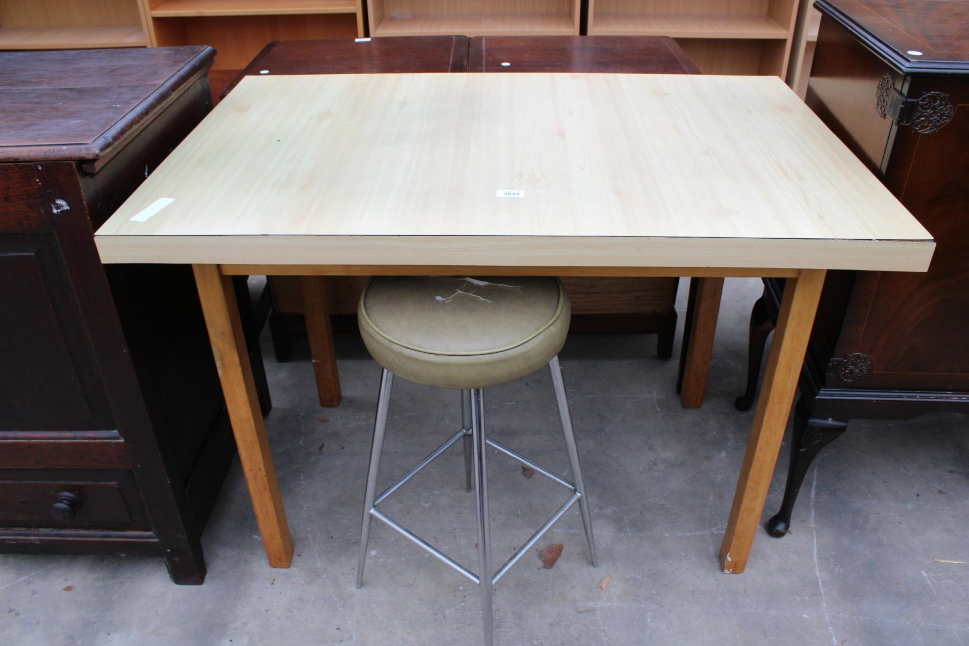 A FORMICA TOP KITCHEN TABLE 43" X 28" AND A KITCHEN STOOL