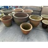 AN ASSORTMENT OF GLAZED AND TERRACOTTA PLANT POTS