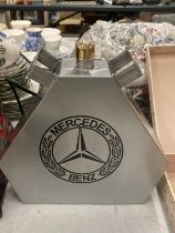 A SILVER MERCEDES OIL CAN