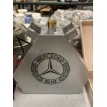 A SILVER MERCEDES OIL CAN