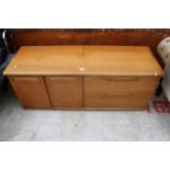 A RETRO TEAK SIDEBOARD BY MEREDEW ENCLOSING TWO CUPBOARDS AND TWO DRAWERS