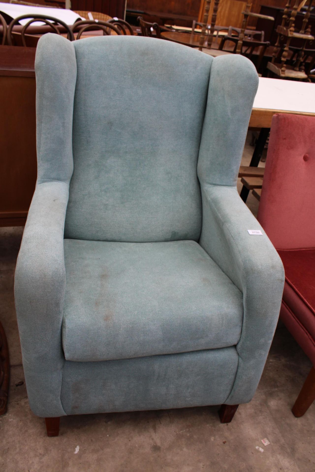 A BLUE WINGED FIRESIDE CHAIR