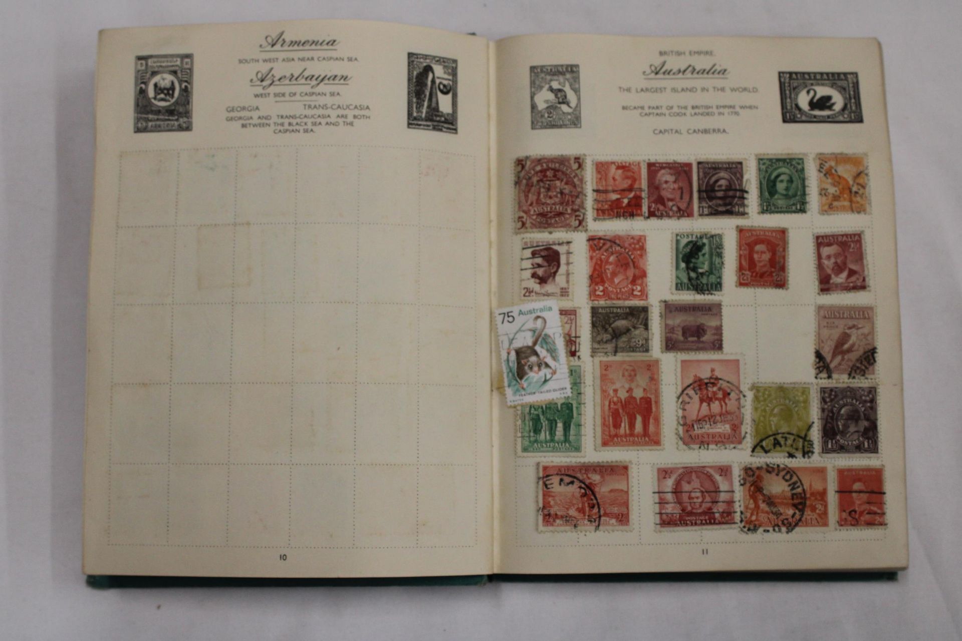 A STAMP ALBUM CONTAINING STAMPS FROM AROUND THE WORLD