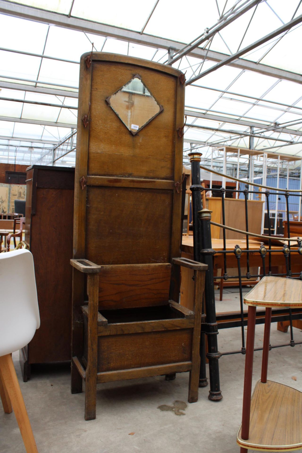 A MID TWENTIETH CENTURY OAK MIRRORED HALL STAND AND DEMI-WINE HALL TABLE - Image 3 of 4