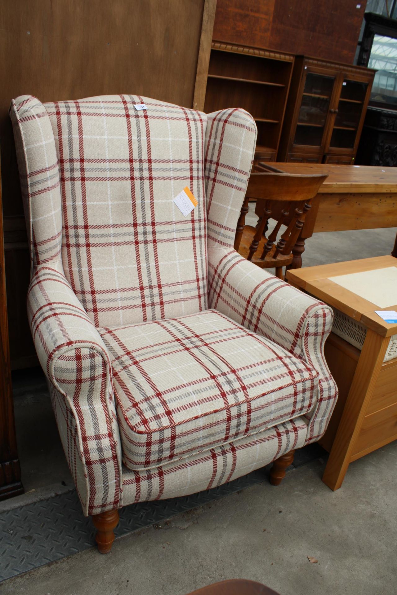 A CHECK PRINT H.S.L. PETITE WINGED FIRESIDE CHAIR ON TURNED FRONT LEGS