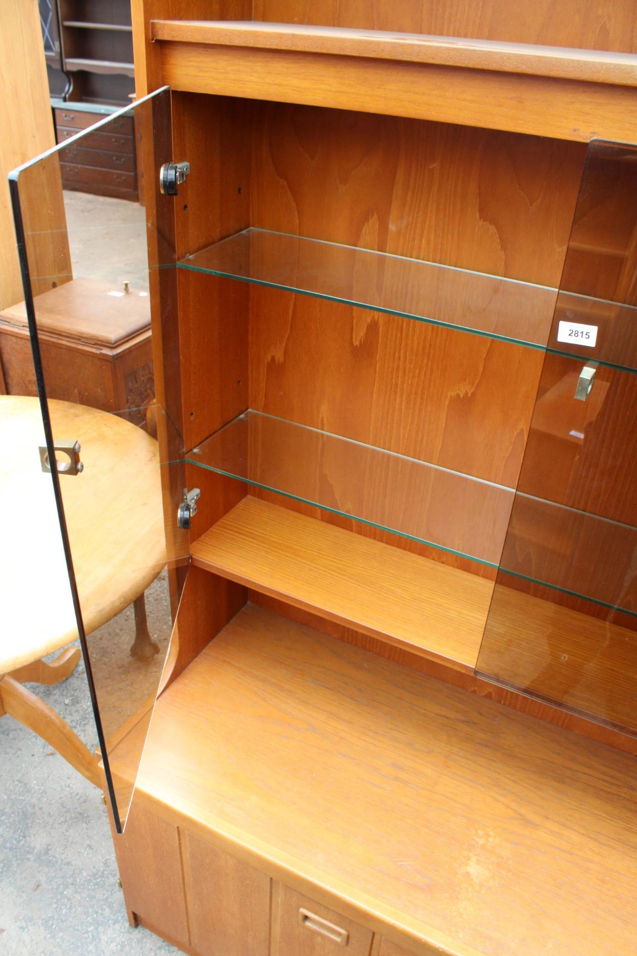 A RETRO TEAK UNIT WITH SMOKED GLASS DOORS, CUPBOARD AND DRAWERS TO BASE. 39.5" WIDE - Image 3 of 3