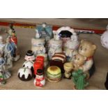 A COLLECTION OF NOVELTY CRUET SETS AND STORAGE JARS