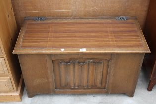 A MODERN OAK BLANKET CHEST WITH LINEN FOLD PANEL, 35" WIDE