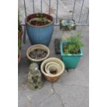 AN ASSORTMENT OF VARIOUS GARDEN POTS AND A CONCRETE SUN DIAL