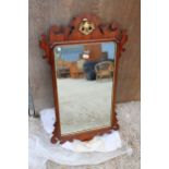 A 19TH CENTURY STYLE MAHOGANY WALL MIRROR WITH GOLD COLOURED EAGLE CARVING 41" X 24"