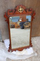 A 19TH CENTURY STYLE MAHOGANY WALL MIRROR WITH GOLD COLOURED EAGLE CARVING 41" X 24"