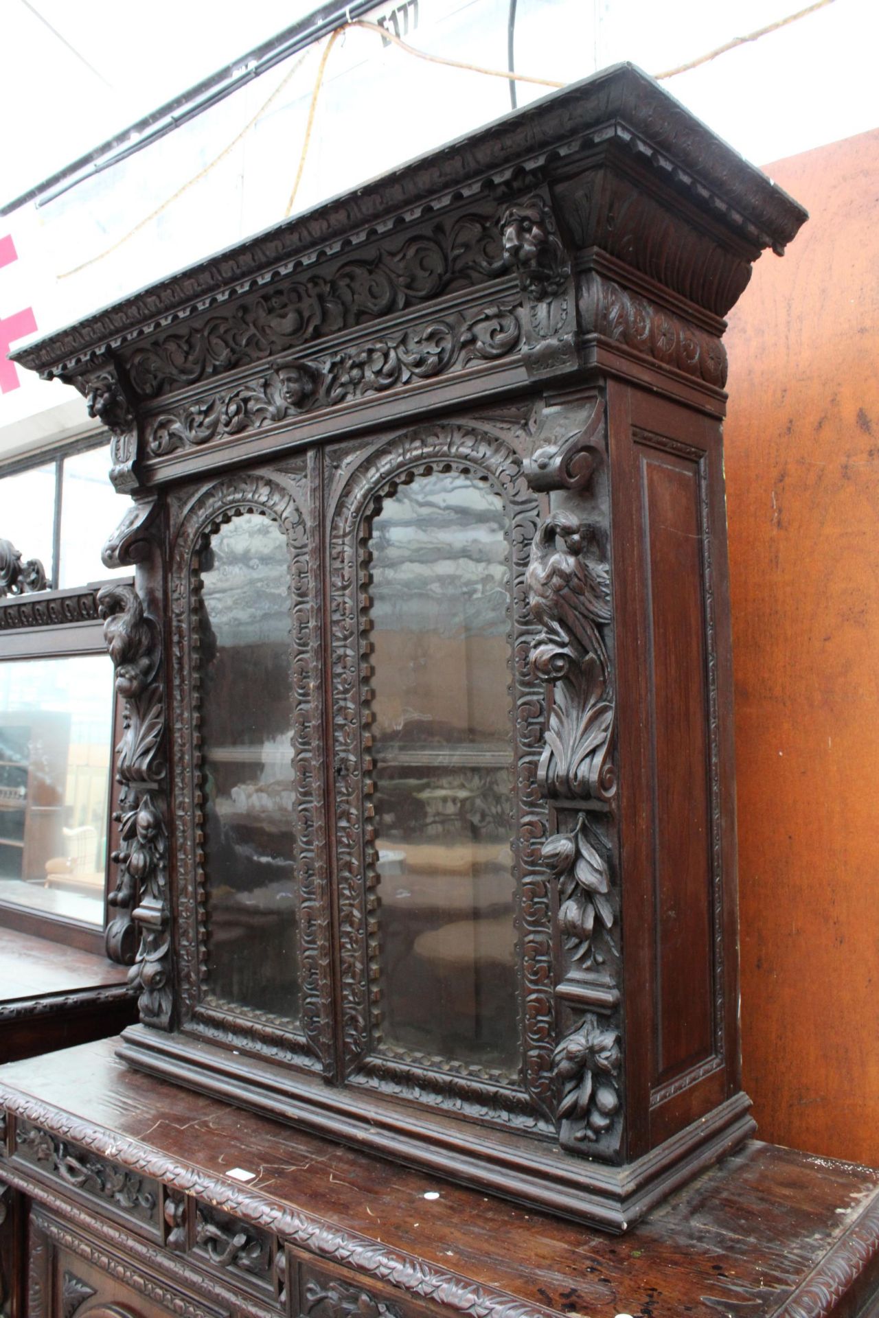 A VICTORIAN OAK BLACK FOREST STYLE SIDEBOARD WITH ASSOCIATED 2 DOOR GLAZED BOOKCASE, ALL HEAVILY - Image 2 of 12