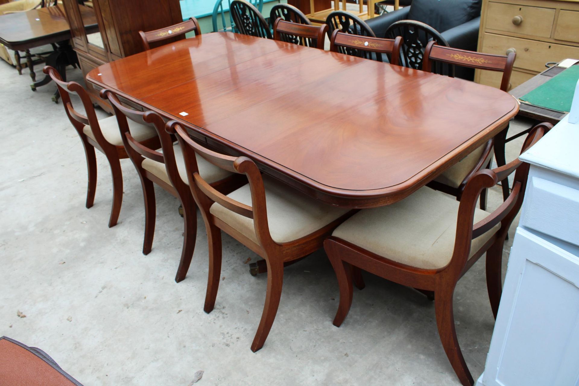 A MAHOGANY REGENCY STYLE EXTENDING TWIN PEDESTAL DINING TABLE 62" X 38" (LEAF 21") AND SIX BRASS - Image 2 of 6