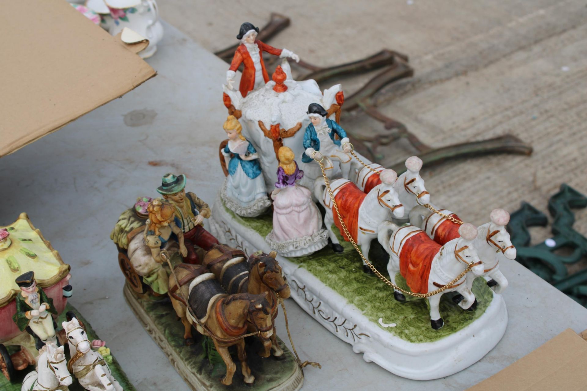 FOUR VARIOUS CERAMIC HORSE AND CART FIGURES - Image 2 of 3