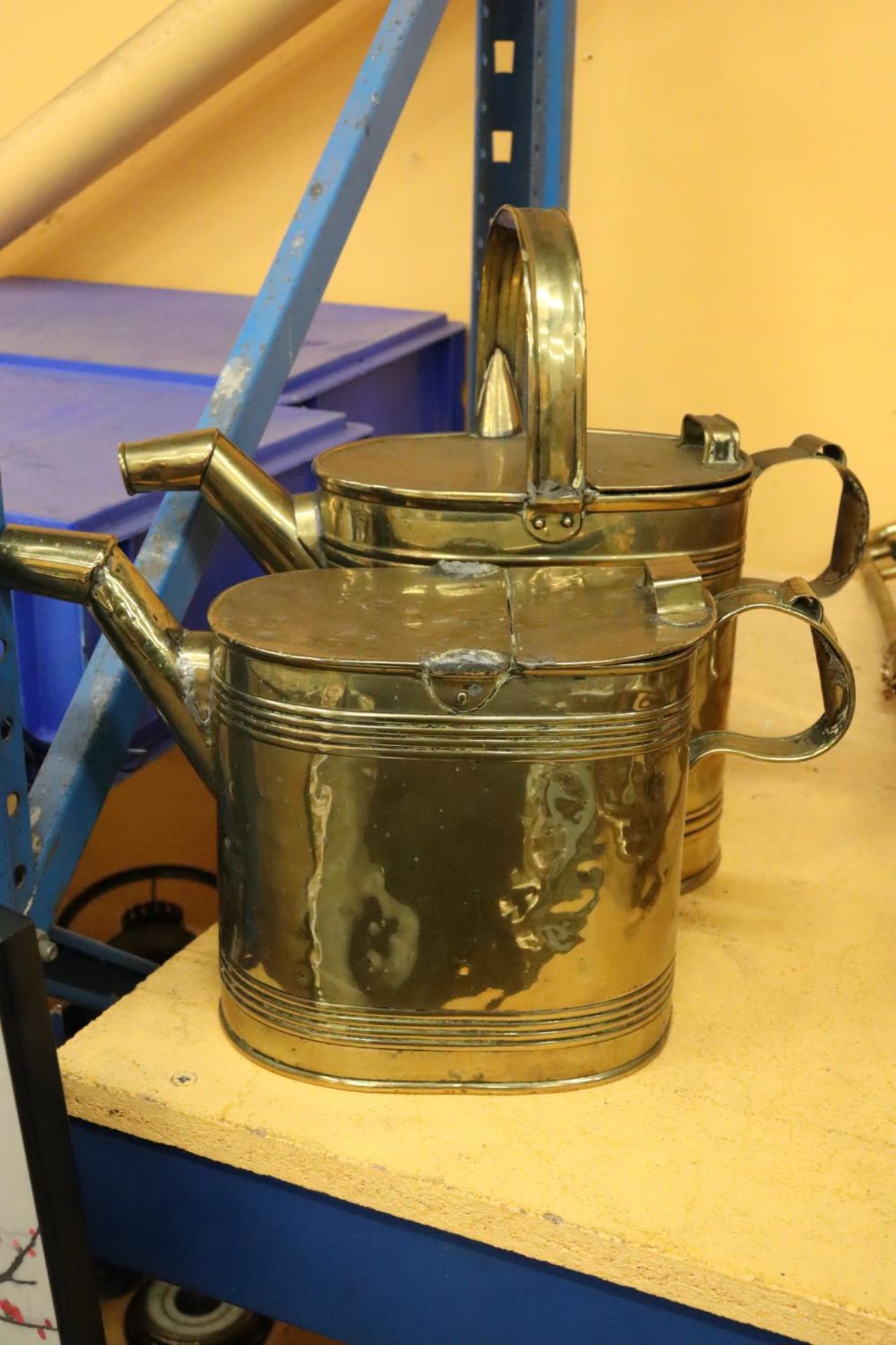TWO BRASS WATERING CANS, ONE MISSING THE HANDLE
