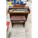 AN ELKA ELECTRIC ORGAN AND STOOL