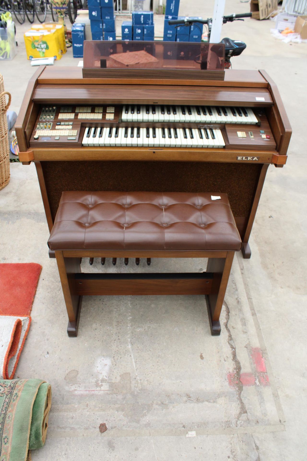 AN ELKA ELECTRIC ORGAN AND STOOL