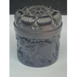 A SMALL ORIENTAL LIDDED CARVED POT
