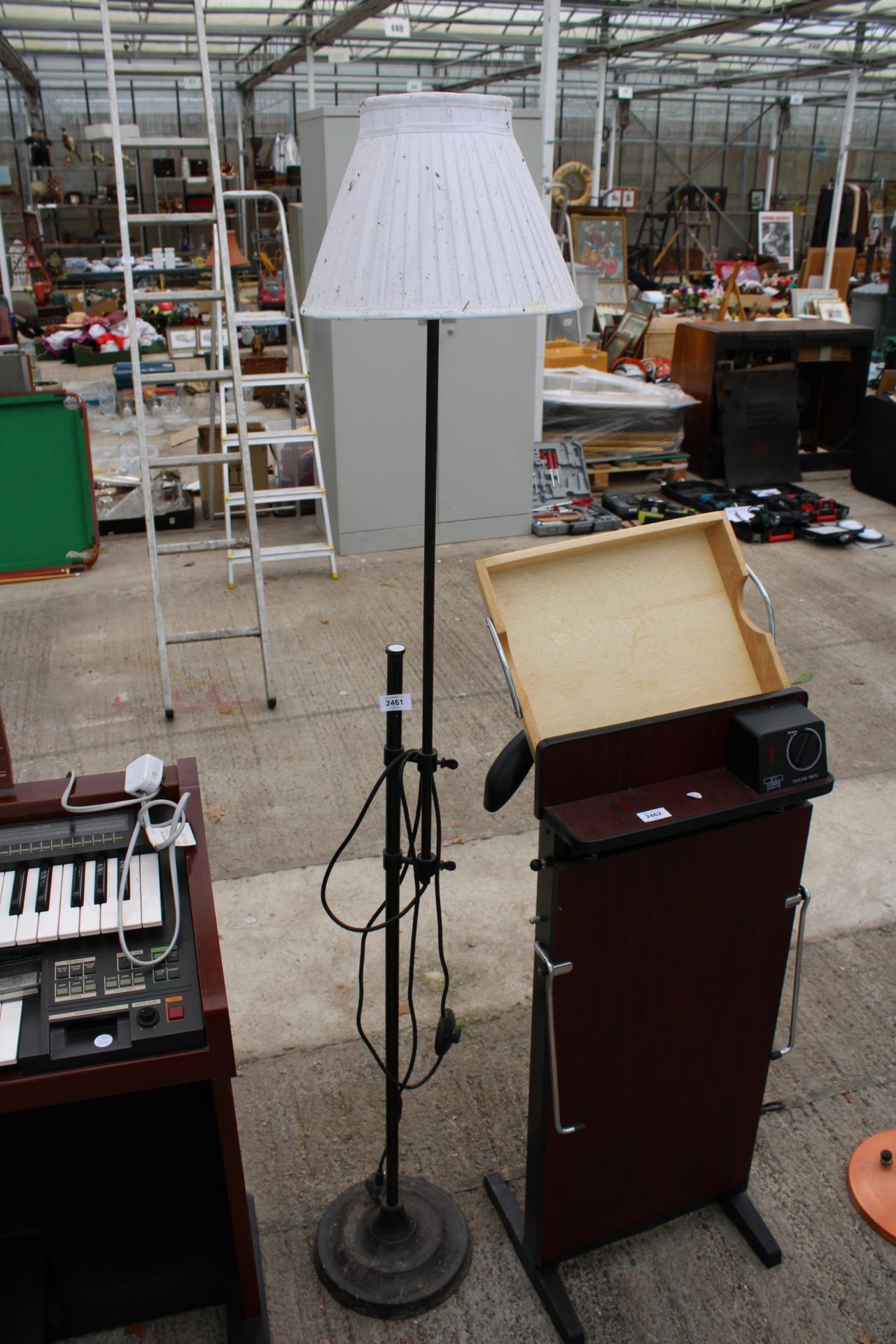 AN ADJUSTABLE STANDARD LAMP