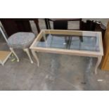 A LIMED COFFEE TABLE WITH GLASS TOP AND A STOOL ON CABRIOLE LEGS