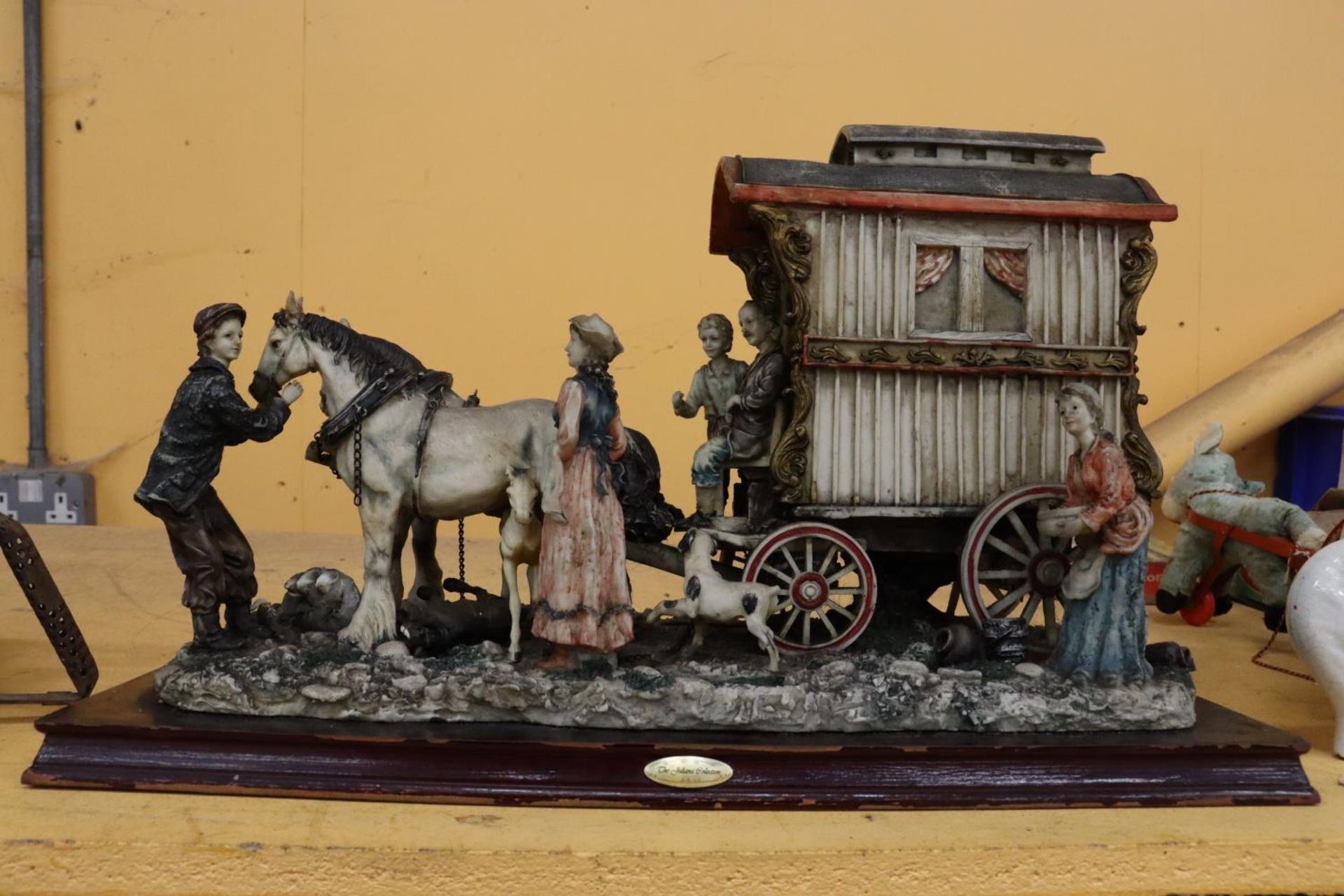 A VERY LARGE 'JULIANA COLLECTION' MODEL OF A ROMANY CARAVAN, HORSES AND FIGURES, ON A WOODEN BASE,