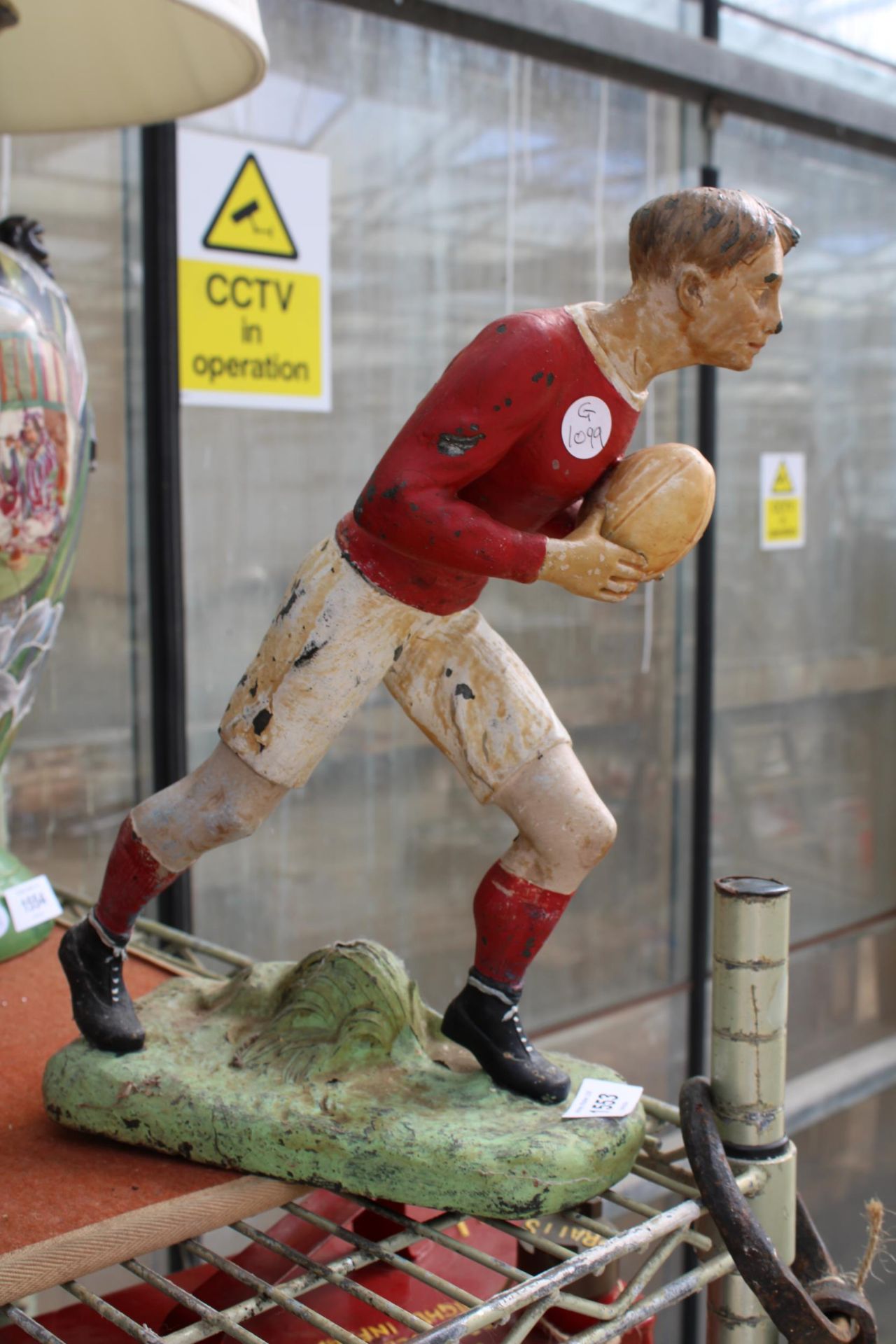 A VINTAGE FIGURE OF A RUGBY PLAYER