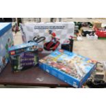 AN ASSORTMENT OF TOYS TO INCLUDE A BOXED LEGO CITY SET, A HARRY POTTER LEGO NIGHT BUS AND A