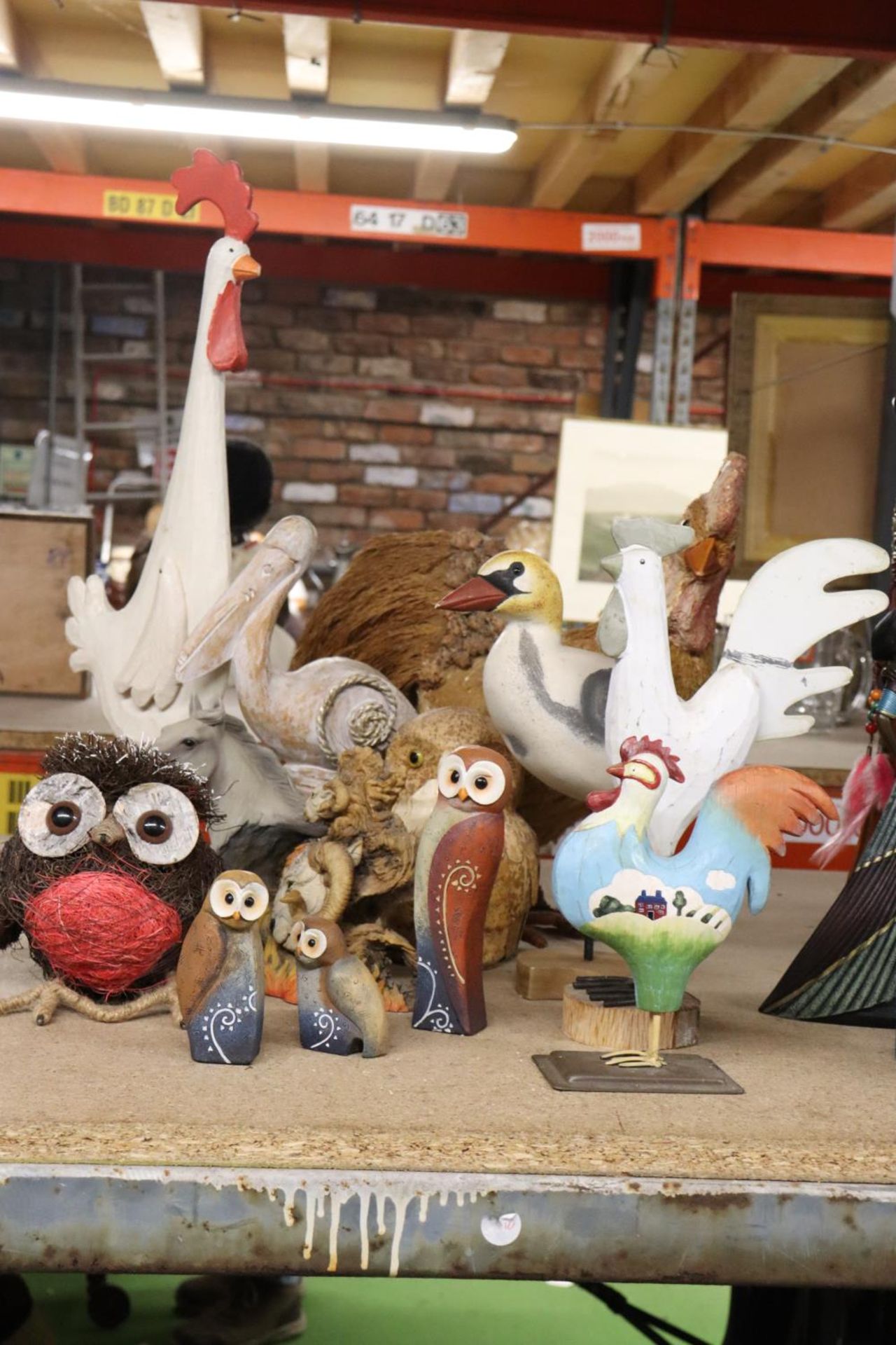 A QUANTITY OF FIGURES TO INCLUDE CERAMIC OWLS, WOODEN BIRDS, HORSE FIGURE, ETC.,