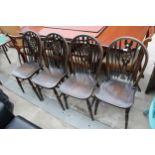 FOUR MODERN WHEEL-BACK WINDSOR STYLE CHAIRS