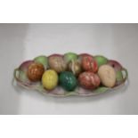 A COLLECTION OF 8 COLOURED MARBLE STYLE EGGS