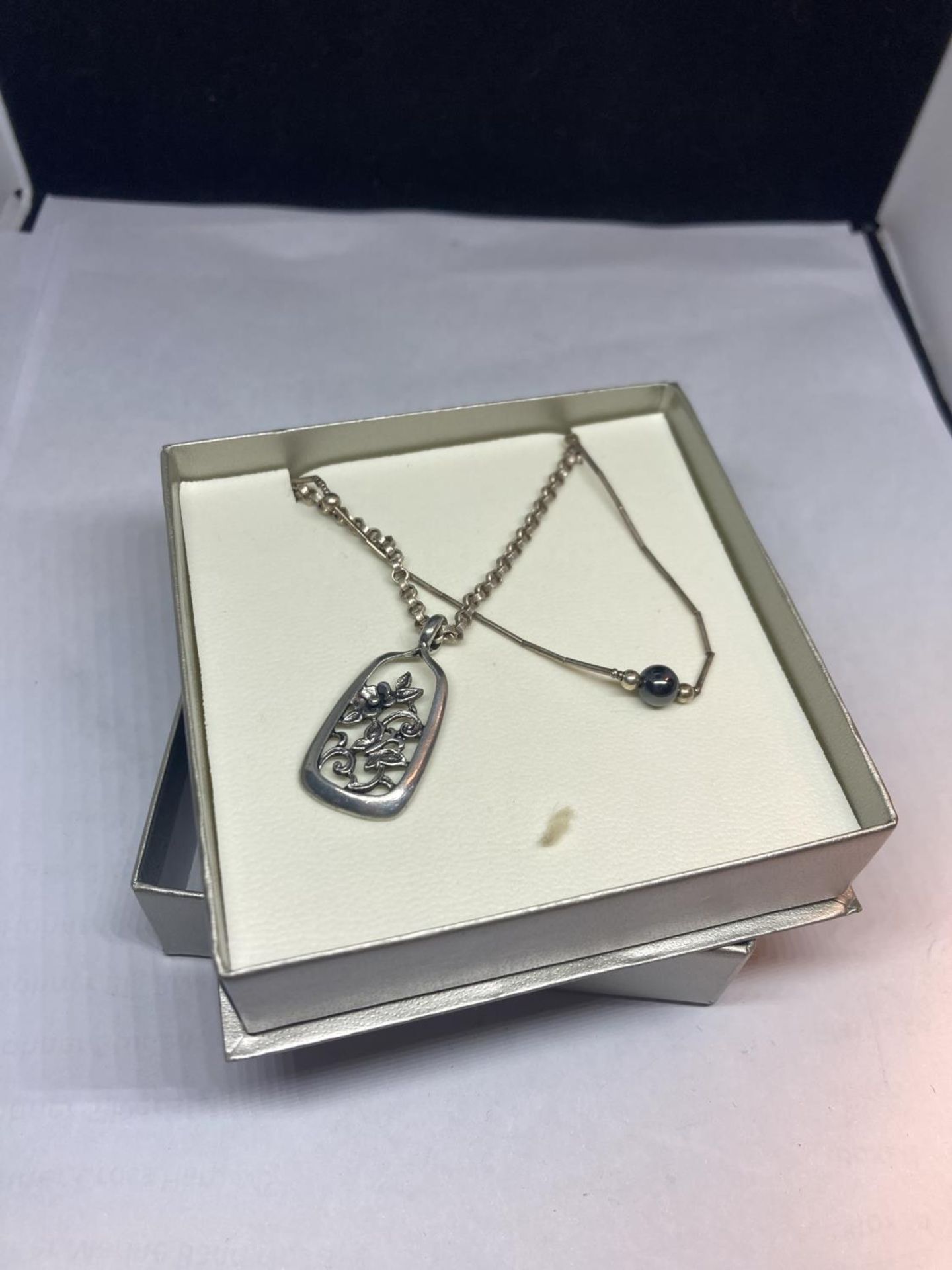 TWO SILVER NECKLACES IN A BOX