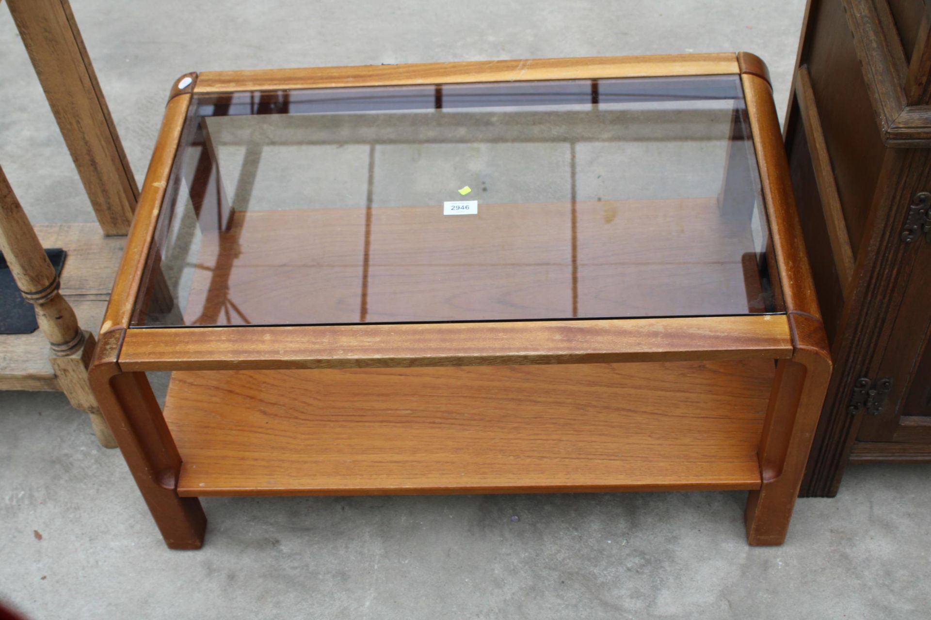 A RETRO TEAK REMPLOY TWO TIER COFFEE TABLE WITH GLASS TOP, 31" X 19"