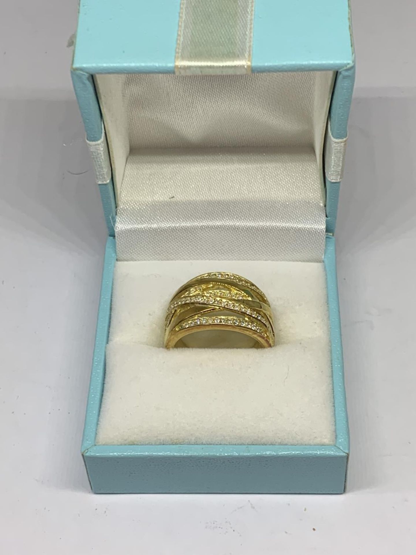 A BOXED SILVER GILT RING