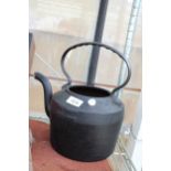 A VINTAGE CAST IRON KETTLE