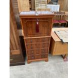 A MODERN YEW WOOD COCKTAIL CABINET ENCLOSING DROP-DOWN FLAP AND FOUR SHAM DRAWERS TO BASE, 23" WIDE