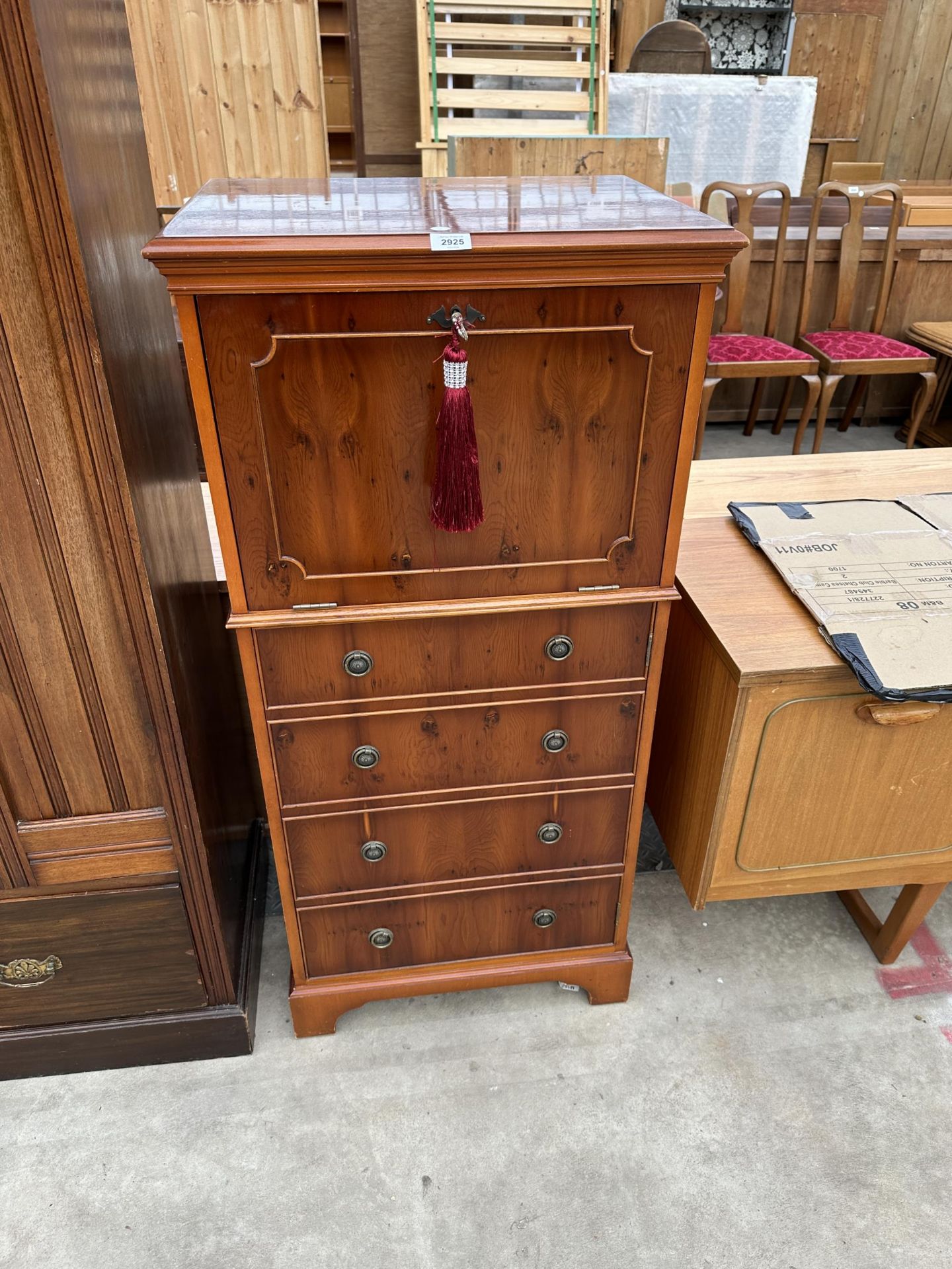 A MODERN YEW WOOD COCKTAIL CABINET ENCLOSING DROP-DOWN FLAP AND FOUR SHAM DRAWERS TO BASE, 23" WIDE