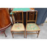 A PAIR OF EDWARDIAN MAHOGANY AND INLAID BEDROOM CHAIRS WITH WOOLWORK SEATS