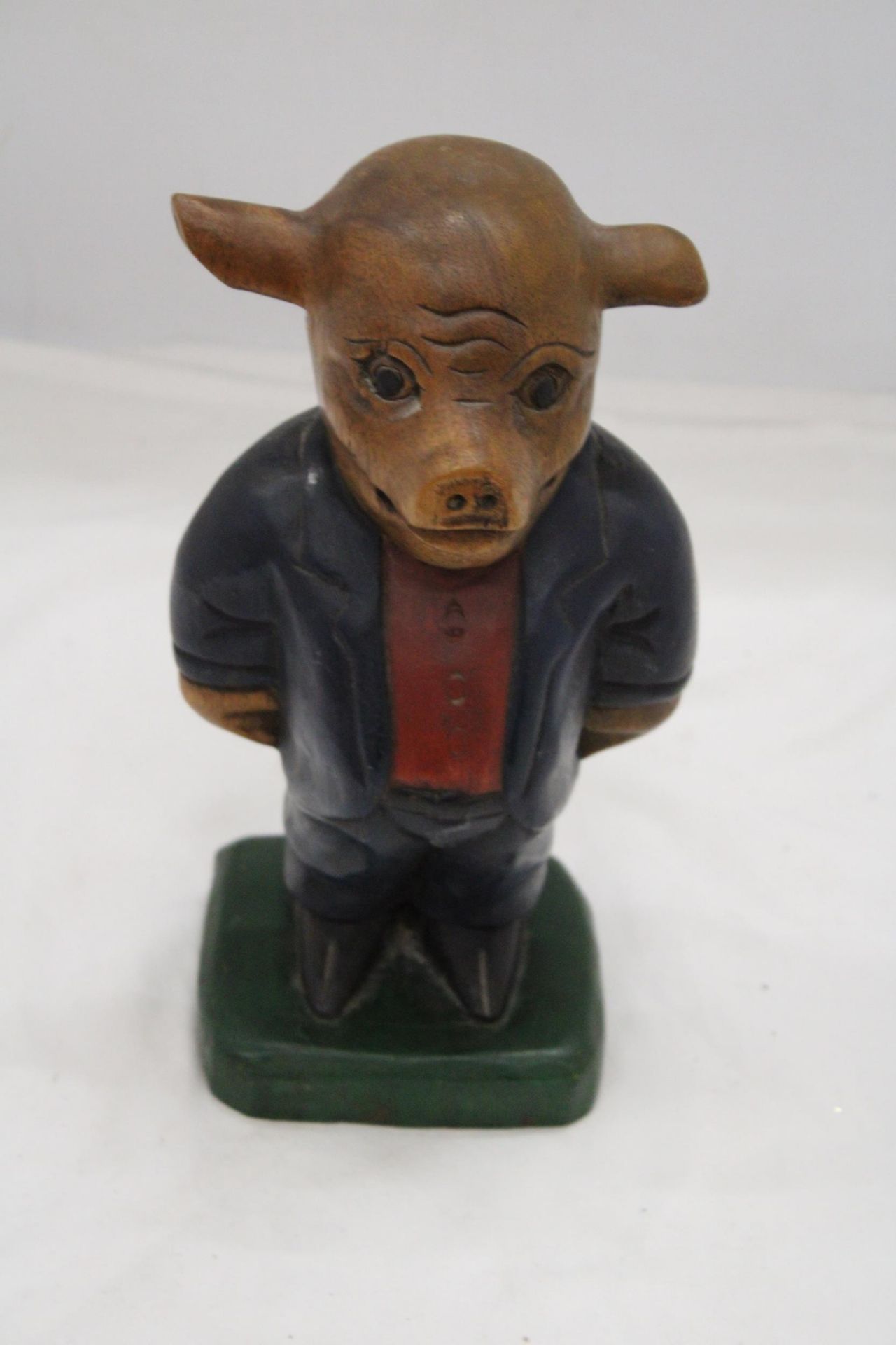 A LARGE, HAND CARVED, HANDPAINTED, WOODEN POSH PIG, HEIGHT 28CM