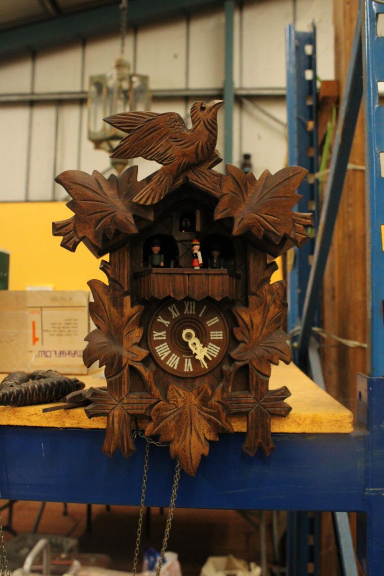 A HAND CARVED BLACK FOREST STERNREITER CUCKOO CLOCK VENDOR STATES IN WORKING ORDER BUT NO WARRANTY