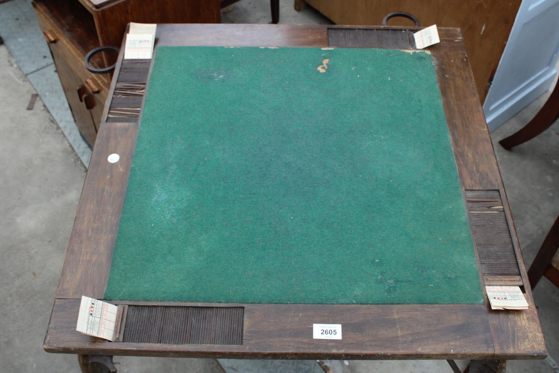 AN EARLY 20TH CENTURY FOLDING CARD TABLE WITH BAKALITE FOLD AWAY GLASS HOLDERS AND TAMBOUR SCORE - Image 2 of 7