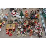 A LARGE ASSORTMENT OF CHRISTMAS DECORATIONS TO INCLUDE SANTA FIGURES, ORNAMENTS AND PLANTERS ETC