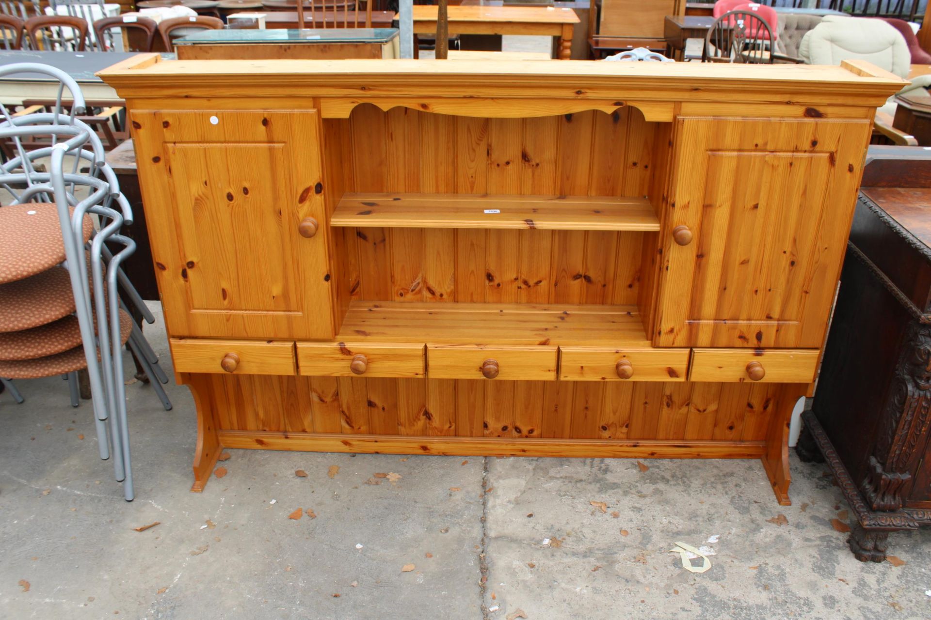 A PINE DRESSER RACK ENCLOSING CUPBARDS AND DRAWERS, 72" WIDE