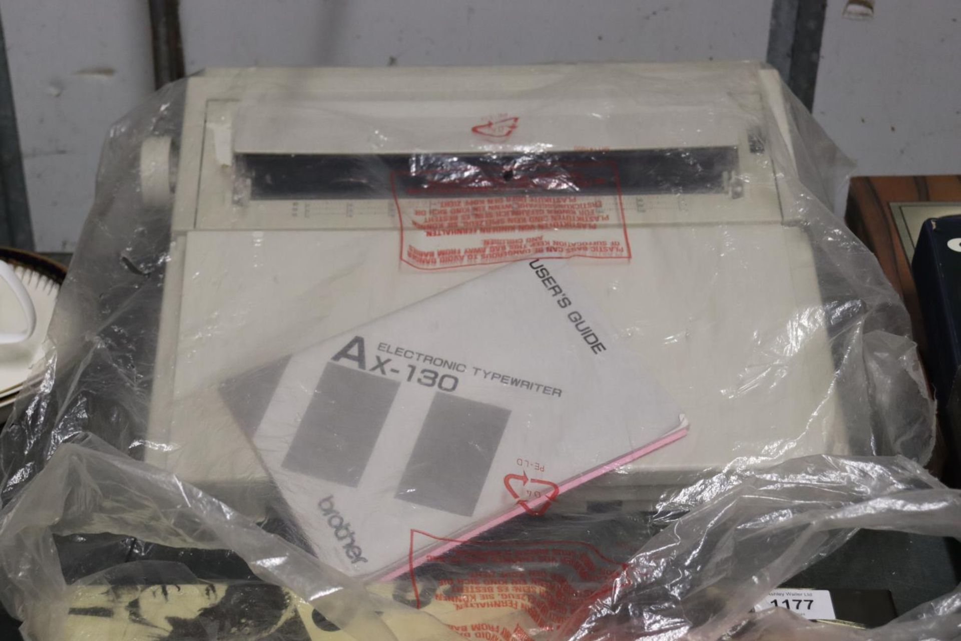 A BROTHER AX-130 ELECTRIC TYPEWRITER AND USER'S GUIDE